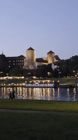 Wawel Castle glowing at twilight above the Vistula