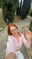 Woman takes selfies in Sanremo park