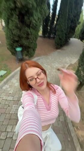 Woman takes selfies in Sanremo park