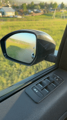 Car interior filmed in Krasnoyarsk, window partially open