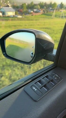Car interior filmed in Krasnoyarsk, window partially open
