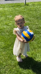 Family volleyball gathering features toddler in Grünberg, Germany