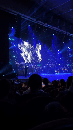 Orchestra performs at Almaty theater with multimedia display