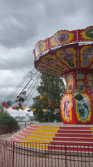 Chair swing ride operates in Izhevsk under overcast skies
