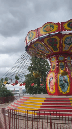 Chair swing ride operates in Izhevsk under overcast skies