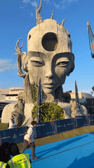 Outdoor art installation gathering draws visitors for photos, activities