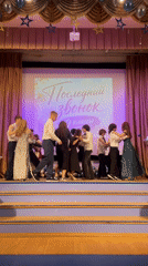 Students perform dance in colorful formal attire in Moscow