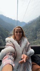 Woman enjoys gondola ride through Zhangjiajie mountains
