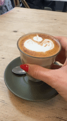 Coffee break at a Bellingen cafe, latte art and all