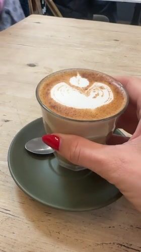 Coffee break at a Bellingen cafe, latte art and all