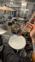 Drummer practices in soundproofed studio in Шемякино, Russia