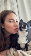 Woman and Chihuahua share quiet afternoon moments in Tel Aviv