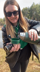 Woman poses for lakeside photos in Novyi, Russia