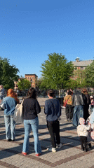 Musical duo performs for gathered crowd in NYC square