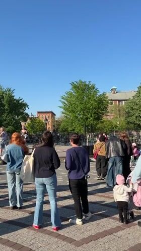 Musical duo performs for gathered crowd in NYC square