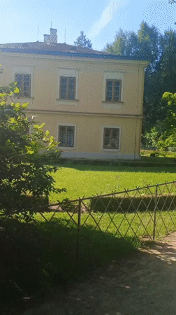Visitor documents historic gardens in Kroměříž on sunny afternoon