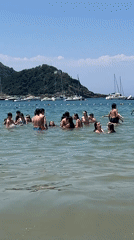 Paddleboarding and beach play on a sunny San Sebastián afternoon