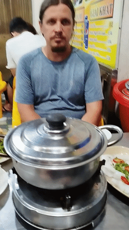 Vietnamese street meal prepared on portable burner in Ho Chi Minh City