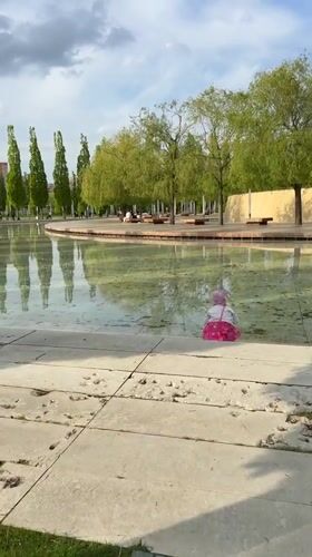 Child visits reflecting pools at Krasnodar park with art installation
