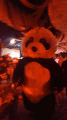 Mascot performers entertain crowds at evening celebration in Jos