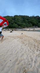 Inflatable wing practice on a cloudy Rawai beach