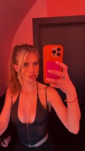 Woman Takes Mirror Selfies in Pink-Lit Berlin Bathroom