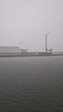 Rainy day vessel journey documented near Dutch offshore wind farm