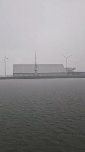 Rainy day vessel journey documented near Dutch offshore wind farm