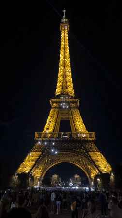 Eiffel Tower glowing gold on a Paris night