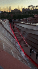 Evening stroll captured at illuminated fountain park in Krasnodar