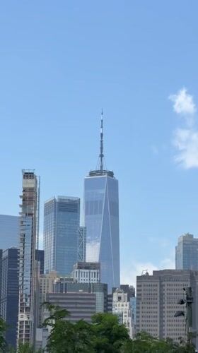 Lower Manhattan skyline on a clear day, One WTC dominant.