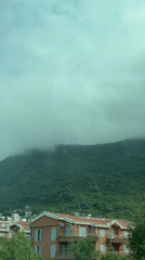 Misty mountain morning observed from window in Montenegro