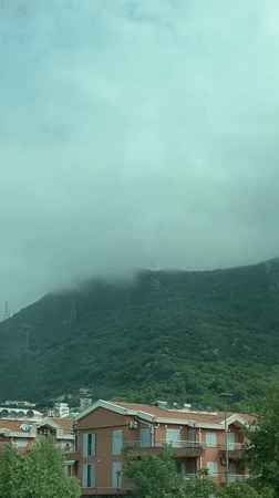 Misty mountain morning observed from window in Montenegro