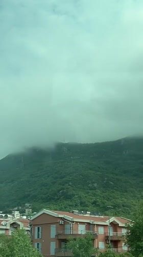 Misty mountain morning observed from window in Montenegro