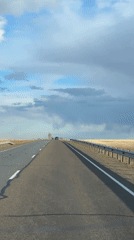 Empty road captured in rural Russia under cloudy skies