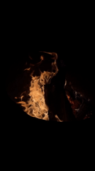 Small fire burns in pit in rural Russia