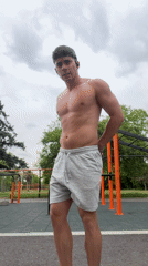 Man exercises shirtless in Sofia park workout area