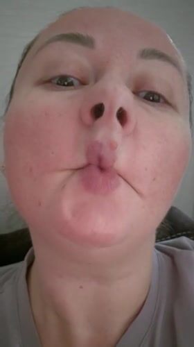 Person makes fish-face expression on camera in Kemerovo