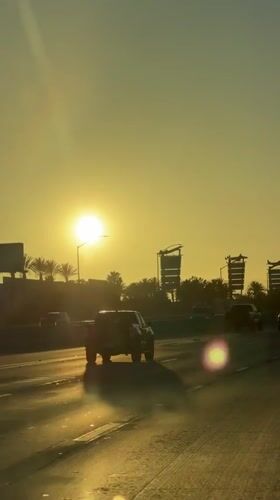 Sunset drive on a Burbank highway, palm trees in the background