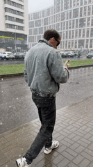 Spring snowfall captures daily life in Murino, Russia