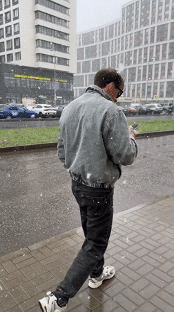 Spring snowfall captures daily life in Murino, Russia