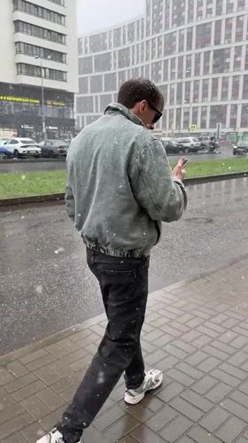 Spring snowfall captures daily life in Murino, Russia