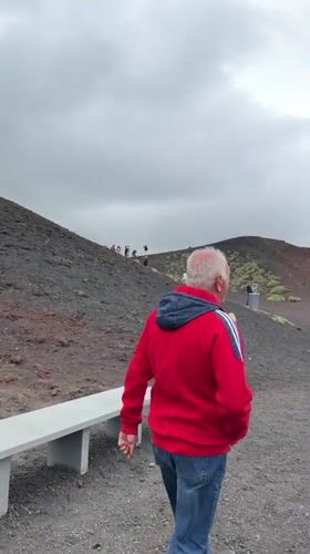 Tourists explore Mount Etna's volcanic slopes near Nicolosi