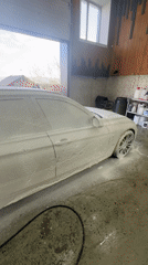 Vehicles documented during detailing session at automotive garage