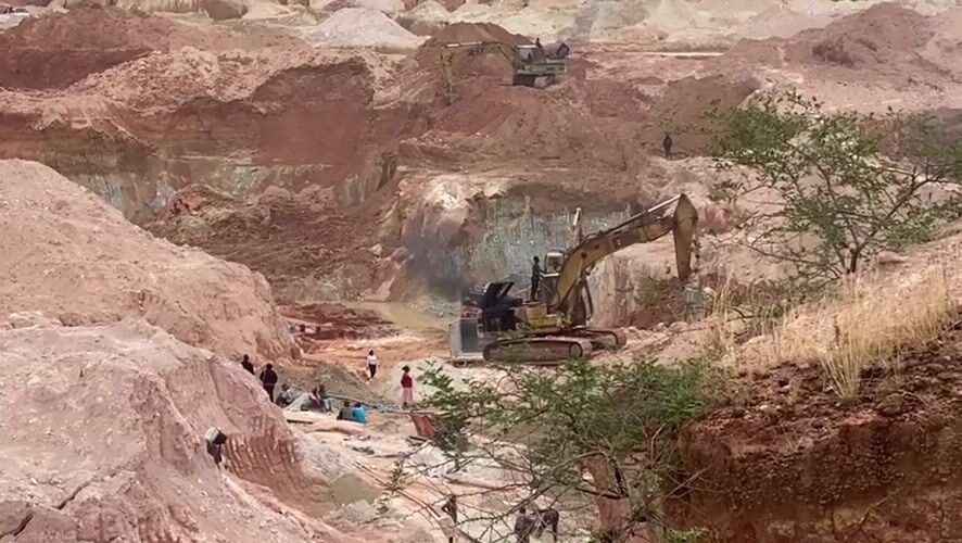 Mining excavators operate at open-pit site in Gura Top