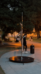 Aerial fitness performers practice near Varna cathedral at dusk