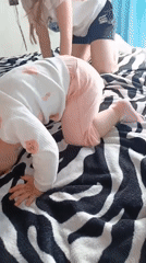 Mother and baby documented in bedroom during morning hours