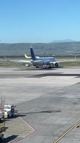 Airport worker spotted on sunny Tbilisi tarmac