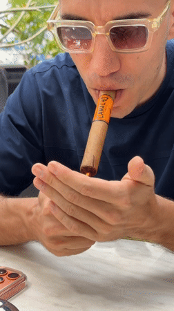 Relaxed outdoor smoking and drinking scene documented in Petah Tikva