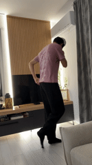Young man plays guitar on sofa in Burgas home
